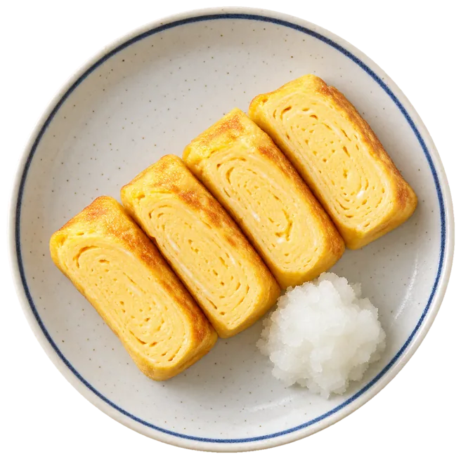 だし巻き玉子を四切れ並べた皿を真上から見たところ